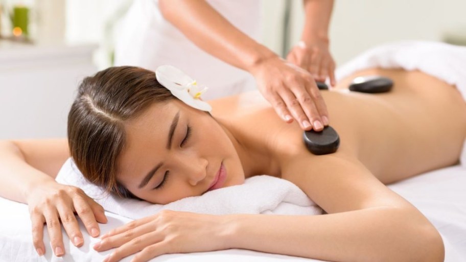 During a back stone massage, warmth penetrates deep into the muscles to ease tension and reduce stiffness