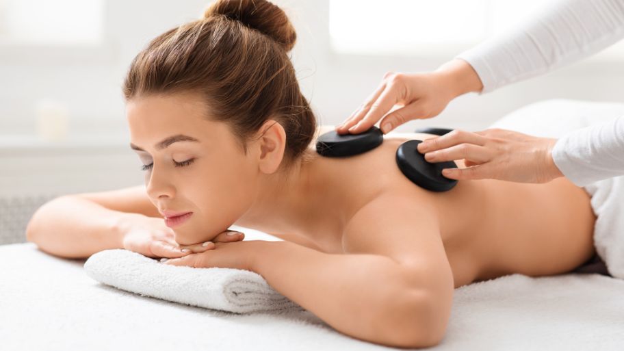 Full body hot stone massage and the art of deep relaxation Helps ease muscle tension throughout the body