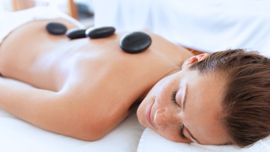 The soothing warmth used in a hot massage back treatment helps relax muscles and surrounding tissues