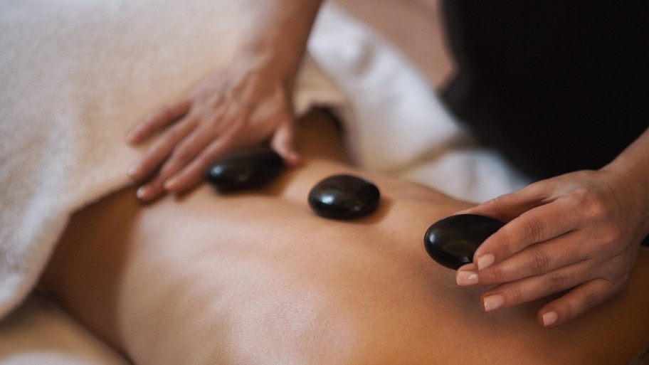 Hot stone massage therapy can provide gentle comfort for people undergoing cancer treatment