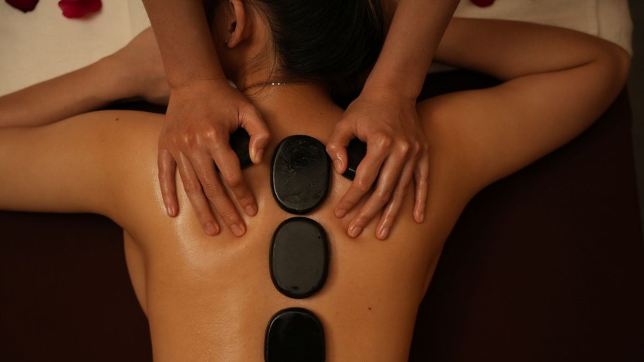 Hot stone massage is a therapeutic treatment that incorporates heated basalt stones to enhance traditional massage techniques